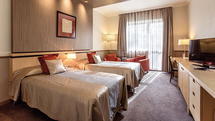 A Deluxe Twin bedroom in the Mamaison Andrassy Hotel, Budapest